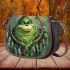 grinchy smile and dream catcher Saddle Bag