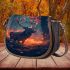 Majestic deer with antlers in a forest at sunset saddle bag