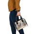 Majestic deer with impressive antlers standing in the forest shoulder handbag