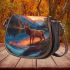 Majestic stag stood tall on the edge of an alpine lake saddle bag