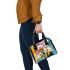 Painting of calla lilies in bold geometric shapes shoulder handbag