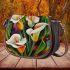 Painting of calla lilies in bold geometric shapes saddle bag