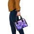 Purple crocuses with purple butterflies shoulder handbag