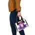 Purple tree frog wearing crown shoulder handbag