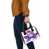 Purple tree frog wearing crown shoulder handbag