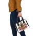 Queen bee sitting on top of honeycomb shoulder handbag