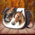 Realistic drawing of a horse and foal in profile saddle bag