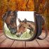 Realistic drawing of an adult horse and foal saddle bag