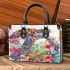 Sea turtle with tropical flowers and leaves small handbag