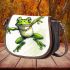 Simple cute cartoon drawing of green frog jumping saddle bag