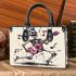 skeleton king dancing with guitar and music notes Small handbag