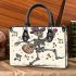 skeleton king dancing with guitar and music notes Small handbag