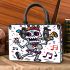 skeleton king is sings with trumpet and music notes Small handbag