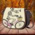 skeleton riding bike with trumpet and music notes Saddle Bag