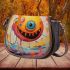 Smiling yellow sphere in whimsical environment saddle bag