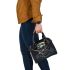 Standing tall amidst its forest habitat shoulder handbag