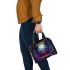 The artwork features colorful and vivid colors in a cartoon style shoulder handbag