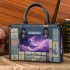 The moon and purple butterflies in the sky small handbag