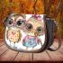The owl on the left is wearing pink heart shaped glasses saddle bag