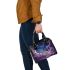 The purple butterflies dance gracefully in the sky shoulder handbag