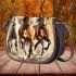 Three horses are galloping in the wind saddle bag