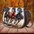 Three horses galloping in the wind saddle bag