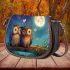 Two cute cartoon owls sitting on a log in love saddle bag