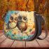 Two cute owls sitting on flowers saddle bag