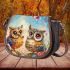 Two cute owls sitting on flowers saddle bag