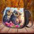 Two cute owls sitting on flowers saddle bag