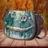 Two cute owls with feathers in shades of blue saddle bag