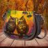 Two owls in love looking at each other with an owl family saddle bag