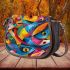 Vibrant and colorful painting of fish saddle bag