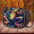 Vividly colored frog dancing on its hind legs saddle bag