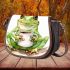 Watercolor cute and happy green frog sitting with coffee mug saddle bag