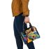 Watercolor painting with colorful patterns and shapes shoulder handbag