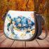 Whimsical watercolor turtle with floral patterns saddle bag
