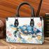 Whimsical watercolor turtle with floral patterns small handbag