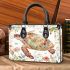 Whimsical watercolor turtle with floral patterns small handbag