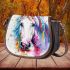 White horse with colorful paint splashes on its face saddle bag