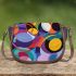 Abstract composition with geometric shapes and vibrant colors saddle bag