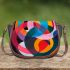 Abstract composition with geometric shapes and vibrant colors saddle bag