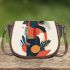 Abstract design with geometric shapes and organic forms saddle bag