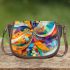 Abstract painting of colorful shapes and circles saddle bag