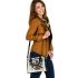 Abstract with shapes and lines in bold colors like blue shoulder handbag