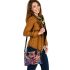 An intricate colorful painting shoulder handbag