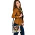 Animal shapes in colorful geometric patterns shoulder handbag