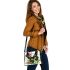 Beautiful butterfly with colorful wings among flowers shoulder handbag