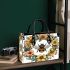 Bee in the center surrounded by flowers small handbag