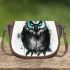 Black and white owl with bright teal eyes saddle bag